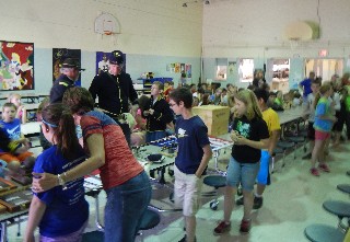 Students peruse the artifacts